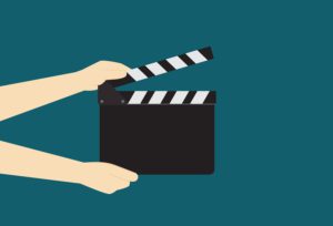 Man Hands Holding Cinema Clapper Board read to take a shot